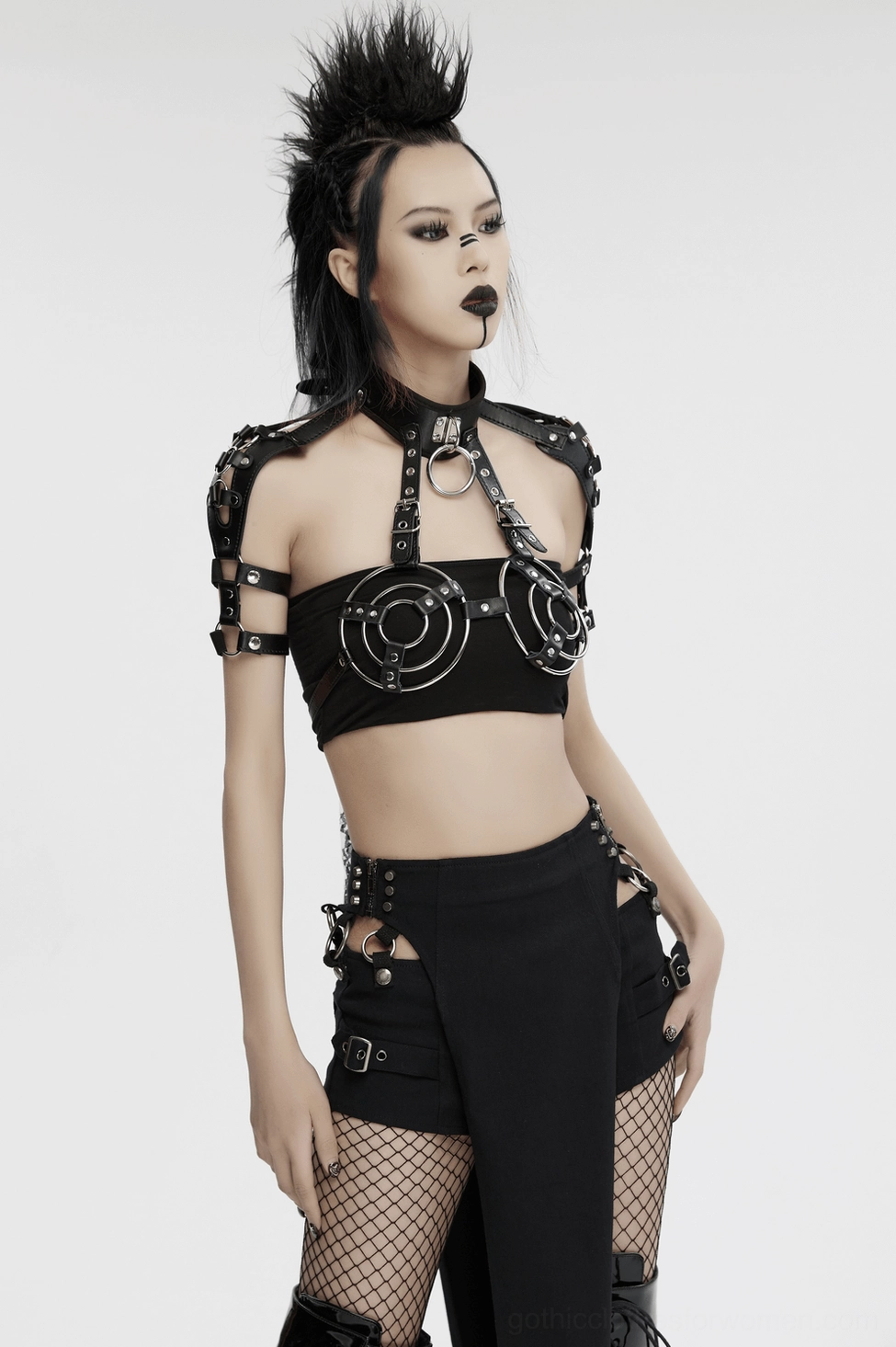 Punk-inspired black leather harness with adjustable straps and O-ring detailing for gothic alternative wear