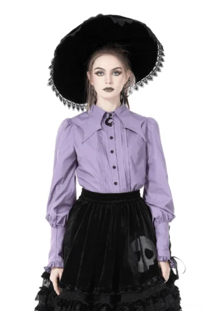 Purple gothic blouse with crescent brooch and adjustable tie cuffs, front view on model