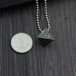 Pyramid silver pendant on beaded chain displayed with one-yuan coin for size reference, top-down view showing scale of gothic necklace pendant