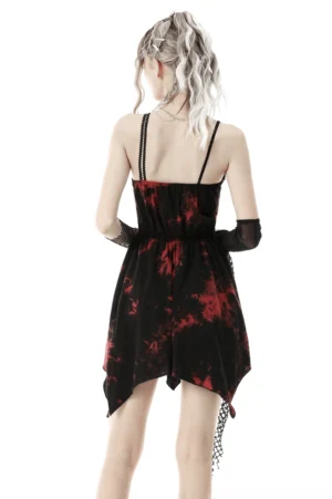 Back view of red and black asymmetrical gothic dress with double spaghetti straps and fishnet hem decoration on model