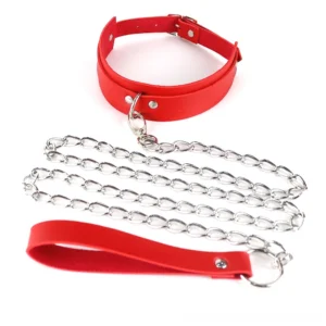 Red gothic chain collar harness with matching leather leash and metal chains, carabiner connector, studio flat lay photography