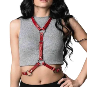 Red synthetic leather body harness with multi-stage adjustable buckles displayed on female model, front half-body portrait