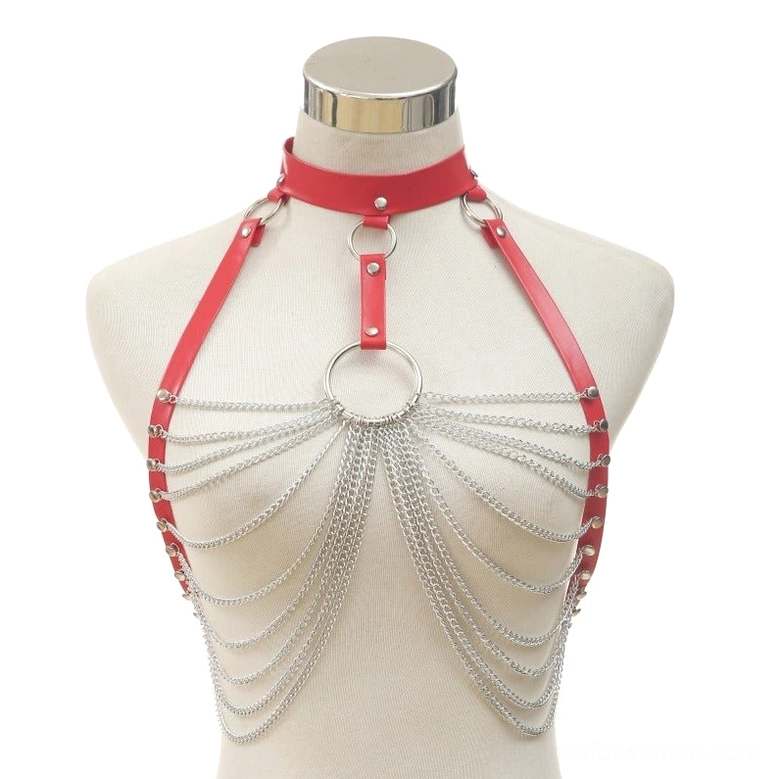 Red leather chest harness with silver layered chains and central O-ring detail on display mannequin
