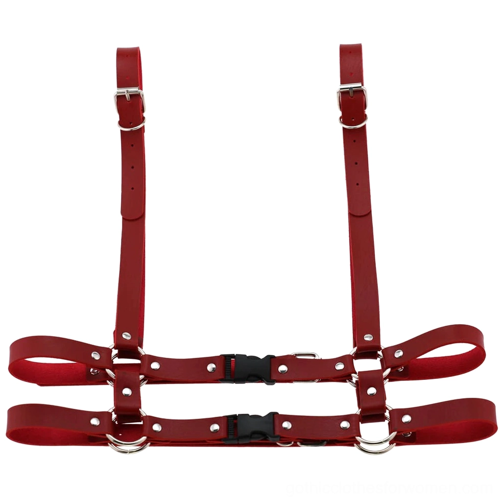 Red leather body harness front flat lay showcasing bold gothic aesthetic with adjustable silver buckle system
