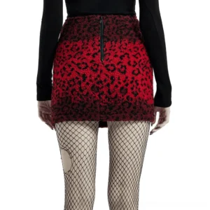 Black and red leopard gothic mini skirt with exposed back zipper closure, rear center view on model