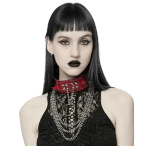Red python grain gothic choker with metal spikes and chains worn by model, frontal upper-body view