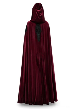 Rear view of burgundy velvet hooded cloak displaying intricate black lace back panel with central red gemstone embroidery