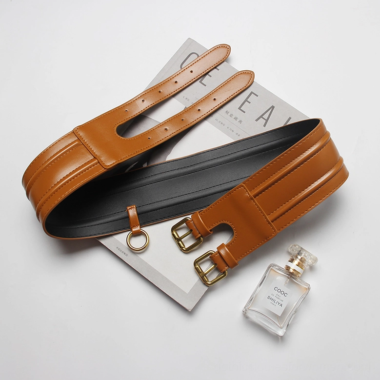 Reversible wide PU corset belt - tan exterior with black interior and gold hardware