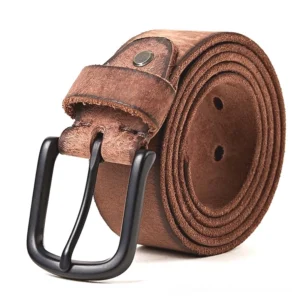 Rolled brown vintage leather belt featuring matte black pin buckle, studio photography white backdrop