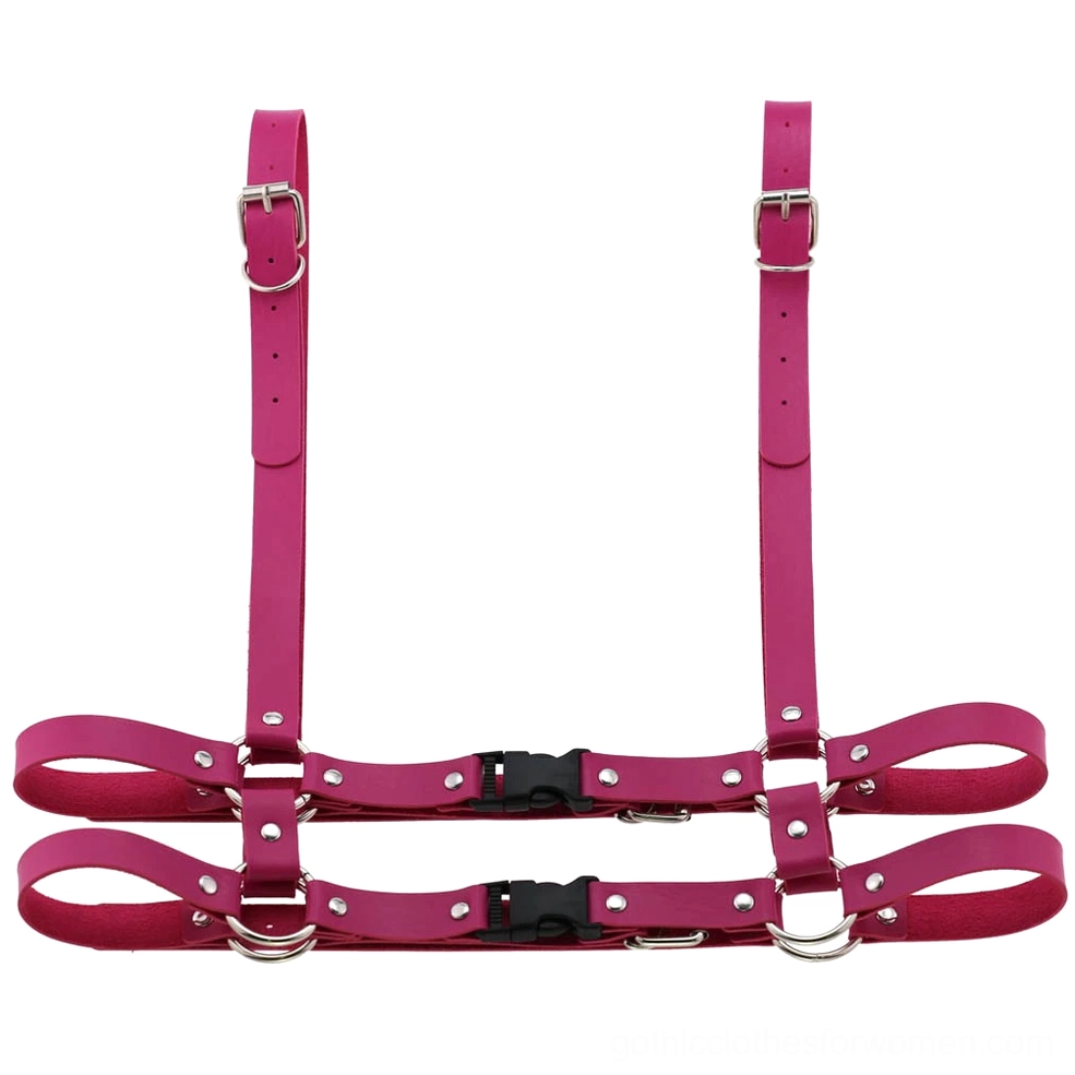 Rose red leather body harness with silver hardware in front flat lay configuration, neo-gothic fashion statement