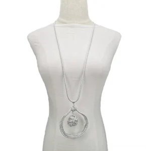 Silver gothic necklace with circular frame and twisted ball pendant on white background studio shot
