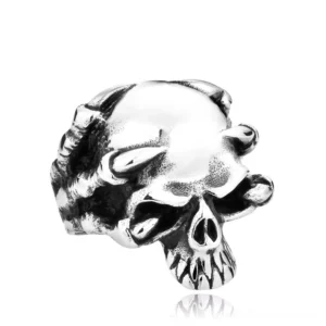 Silver gothic skull claw ring - stainless steel biker jewelry with skeletal carved details, front view on white background
