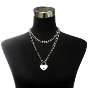 Double-layer silver heart lock chain necklace worn on black gothic mannequin bust, front view displaying pendant detail