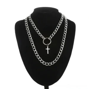 Silver layered cross chain necklace with circle connector and cross pendant displayed on black jewelry mannequin