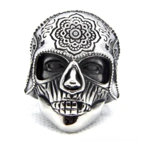 Detailed front view of gothic sugar skull ring displaying embossed mandala flower engravings and realistic skull features in silver finish
