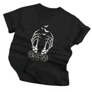 Black gothic graphic t-shirt flat lay angled view, showcasing skeleton hand with rose and bat print, premium cotton broadcloth, rolled cuffs detail, studio background