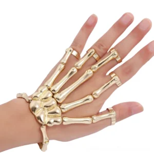 Gold-toned skeleton hand slave bracelet front close-up display with matching finger rings on model hand