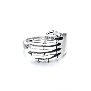 Skeleton hand gothic ring front flat lay view showing detailed bone joint texture vintage silver finish
