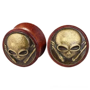 Wine red wooden skeleton skull ear gauges with antique bronze cross-bone design, professional product photography showing front flat view against white background