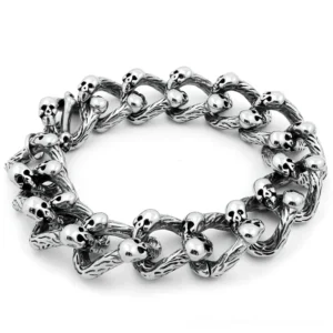 Memento mori skull chain bracelet with double-row curb links and embedded skeleton details, antique silver finish displayed flat lay