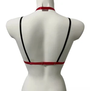 Back view of black and red gothic chest harness showing open back design with adjustable waist straps and metal hardware