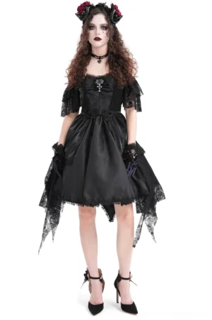 Front full-body view of skull lace gothic halter dress with asymmetrical handkerchief hemline, styled with rose crown on model with pale makeup