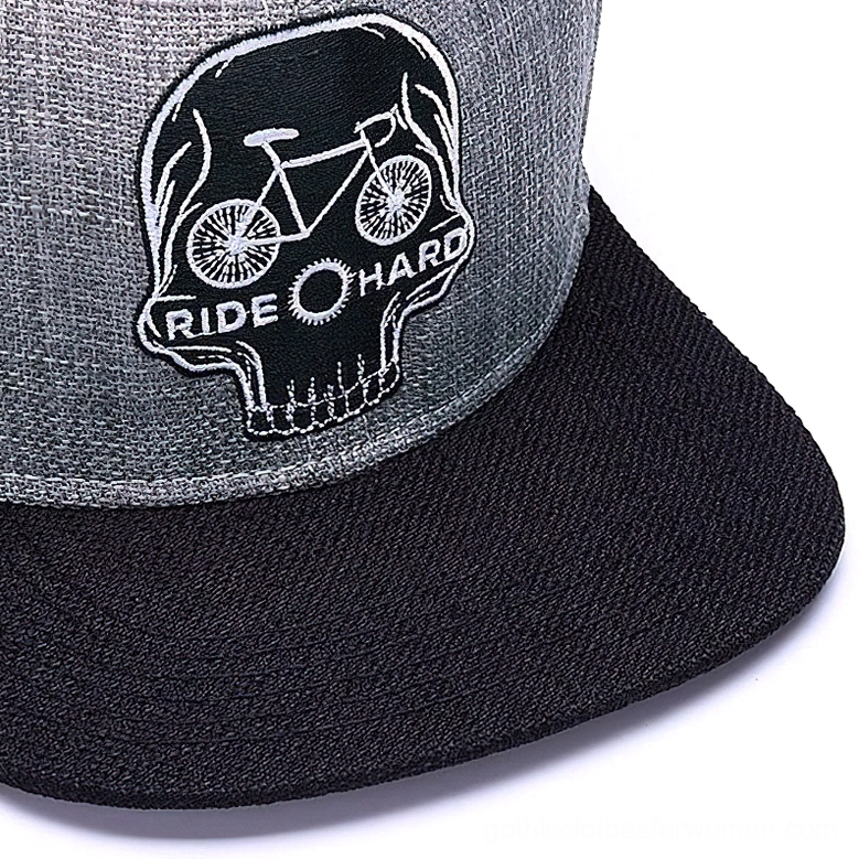 Close-up detail of skull and bicycle embroidery with ride hard text on gothic snapback cap
