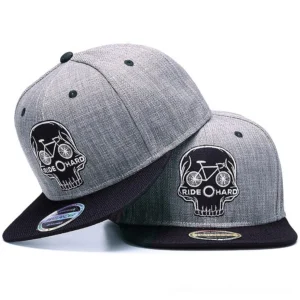 Skull Rider gothic snapback cap oblique view showing embroidered skull and bicycle design with adjustable strap