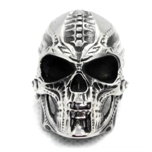 Dark silver skull ring frontal top view displaying full biomechanical skull face design and carved texture