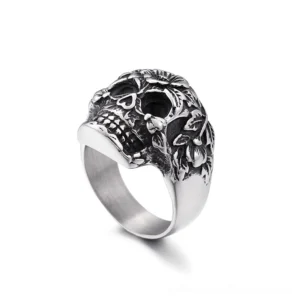 Gothic skull ring side angle showing 3D embossed botanical details and distressed vintage metal finish