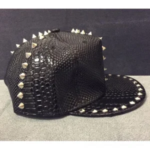 Punk studded snakeskin cap rear angle, displaying silver spike studs on crown and brim edge, gothic hat back perspective