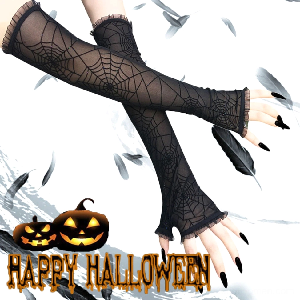 Halloween spider web fingerless gloves overhead view on female model with ruffled cuff, pumpkin-themed background