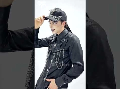 Male model wearing metal spike bull skull gothic cap with dark studio background demonstrating fit and chain shirt pairing