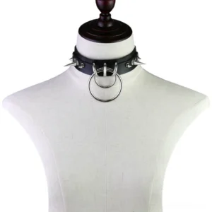 Gothic spiked choker displayed on white mannequin torso, front view showing central O-ring and metal spike decorations