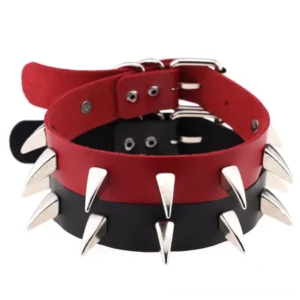 Multiple spiked leather gothic choker necklaces in red and black with silver cone rivets, flat lay studio shot