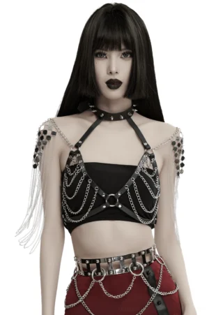 Black spiked halter harness with silver chain shoulders, front view on model with dark makeup