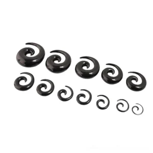 Graded set of black spiral ear expander plugs from small to large diameter, demonstrating progressive gauges for safe ear stretching journey, smooth acrylic finish