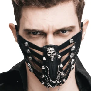 Male model wearing black steampunk gothic mask with central skull decoration, metal spike studs and chains, front close-up view