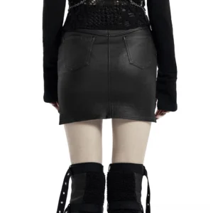 Black steampunk skirt back view showing stretch knit panel and back pockets on female model