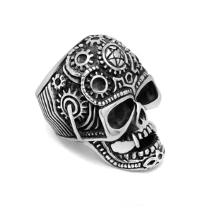 Gothic skull ring displaying right front angle with detailed gear engraving patterns in blackened steel, white studio background