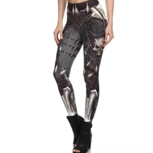 Black steel armor skull printed high-waist gothic leggings with silver metallic print, front oblique view with heeled ankle boots
