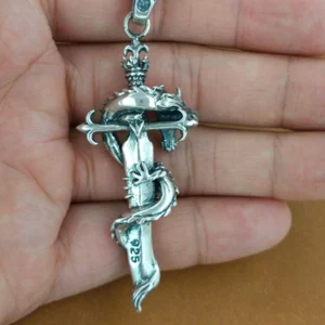 925 sterling silver mark on dragon sword pendant held in palm - authentic fine jewelry certification