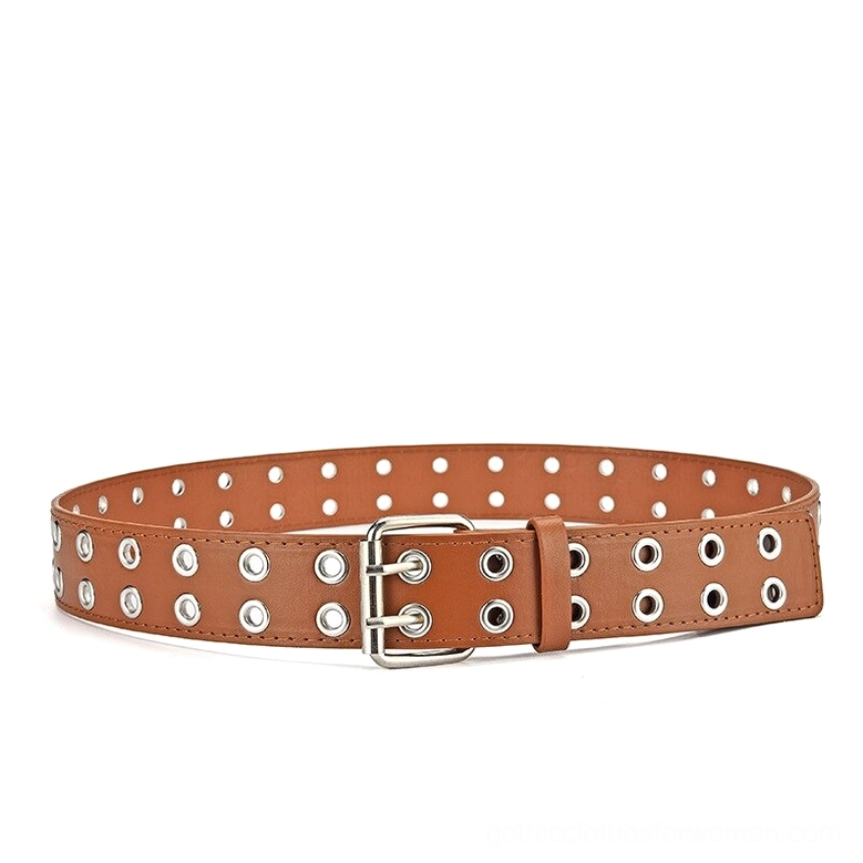 Tan brown gothic grommet belt with single pin buckle and decorative metal rivets, side angle flat lay