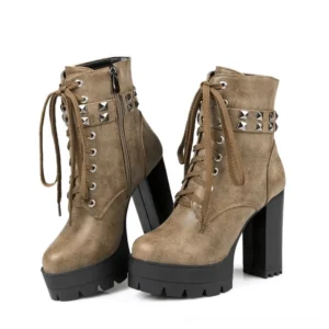 Taupe suede gothic platform heeled boots with lace-up and studded strap detail, frontal angle