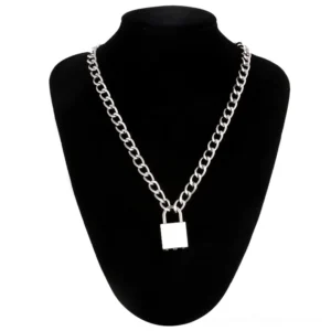 Thick silver curb chain necklace with geometric padlock pendant on black velvet mannequin, gothic aesthetic jewelry