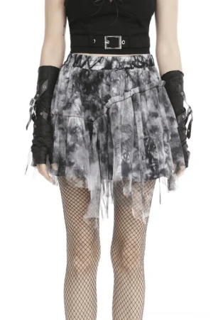 Black and white tie-dye gothic tulle skirt with asymmetrical handkerchief hem worn with fishnet stockings, front view