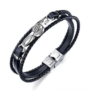 Black treble clef gothic leather bracelet flat lay display showing multi-layer braided PU leather and stainless steel charm