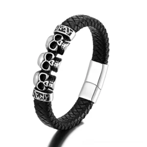 Black leather braided skull bracelet with triple skull ornaments and stainless steel magnetic clasp - front view gothic jewelry