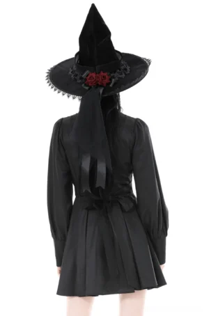 Black Victorian gothic dress back view with satin bow and long sleeves on model
