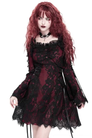 Victorian gothic wine red and black lace mini dress front three-quarter view with flared bell sleeves and square lace neckline worn by model with wine red curly hair